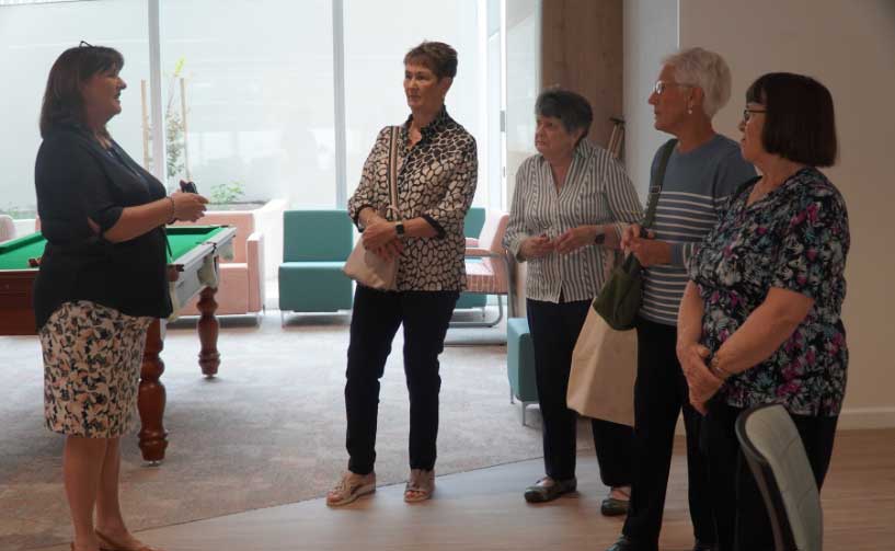 A group of retired nurses returning to their old workplace