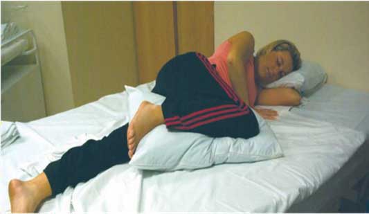 a women lying on the bed in a passive relaxation position