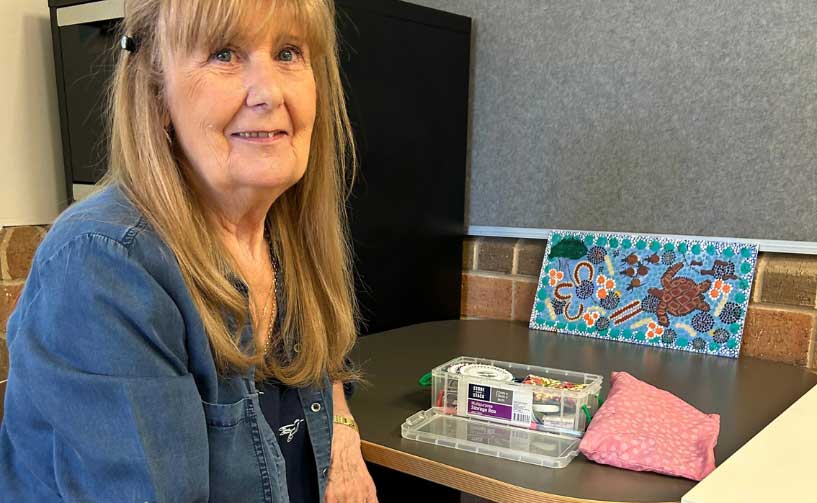 Women with her craft supplies on table