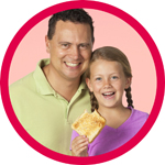 A father with his daughter holding a piece of toast