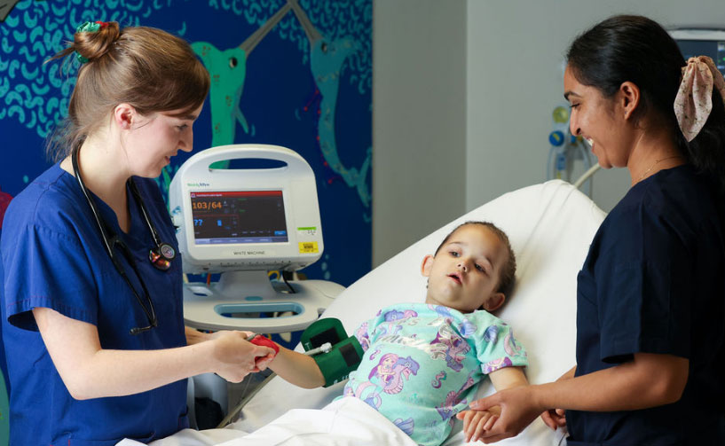 doctors attending to sick child in hospital doctors attending to sick child in hospital